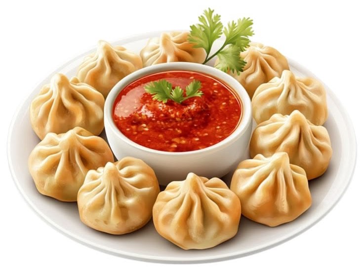 Plate of steamed momos with chilli dip